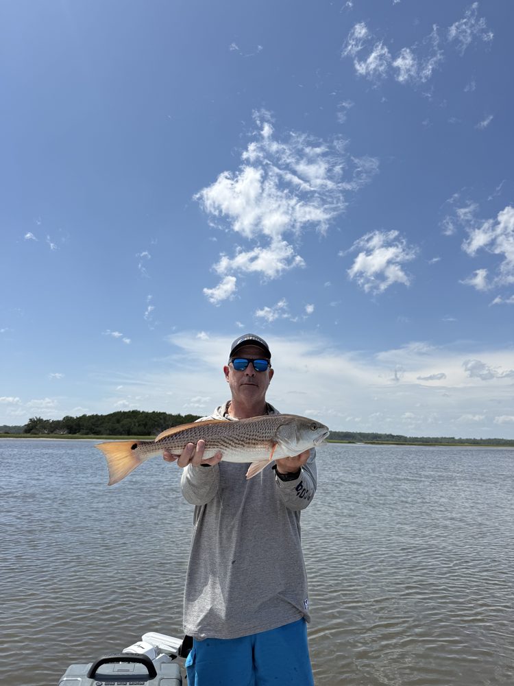Angler on open Intracoastal water under a big sky