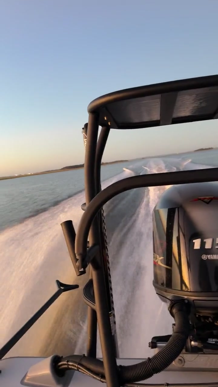 The Maverick skiff running across calm Intracoastal water at golden hour